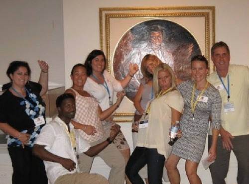 A company's team is having fun at a Museum Quest team building activity.