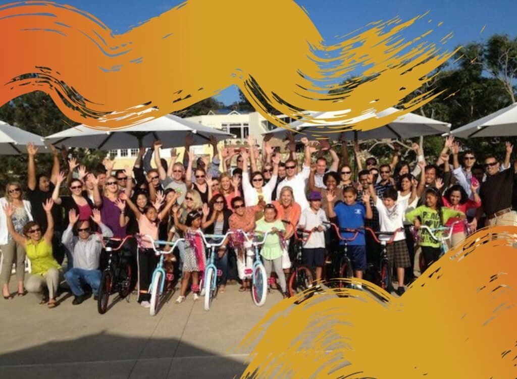 Group posing for a photo after a fun team building event called Build-A-Bike