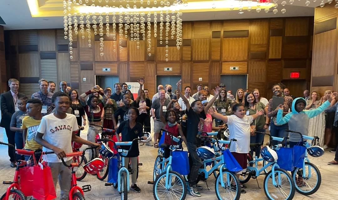 people posing with bikes