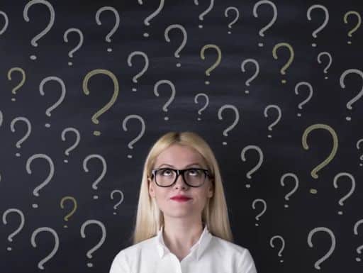 Woman with question marks above her head