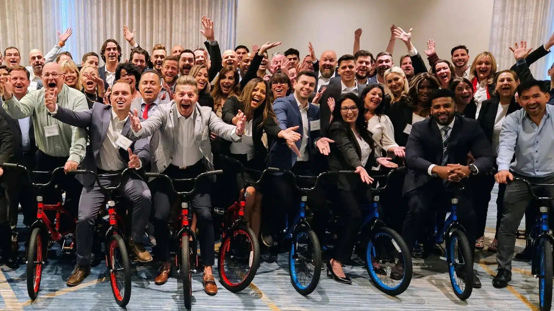 group of people posing with bikes